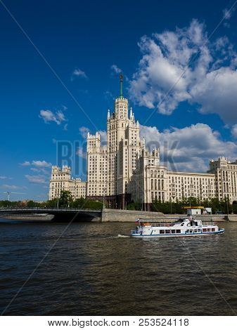 Moscow, Russia - May 12. 2018. Boat On Moskva River Opposite House On Kotelnicheskaya Embankment