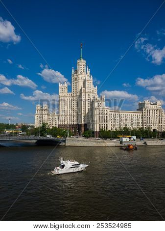 Moscow, Russia - May 12. 2018. Boat On Moskva River Opposite House On Kotelnicheskaya Embankment