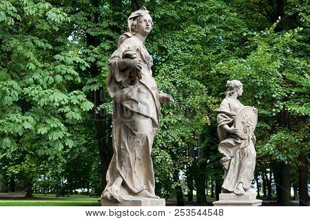 Sandstone Statues In The Saxon Garden, Warsaw, Poland. Made Before 1745 By Anonymous Warsaw Sculptor