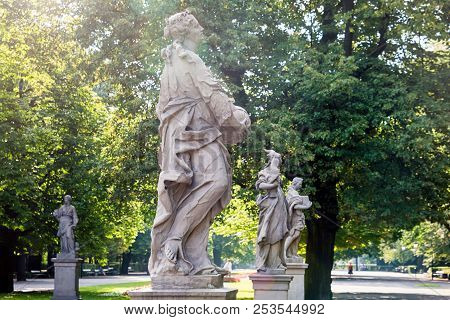 Sandstone Statues In The Saxon Garden, Warsaw, Poland. Made Before 1745 By Anonymous Warsaw Sculptor