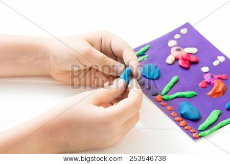 A Child Kneads Plasticine And Sculpts An Aquarium With Fish. Tutoring With Children