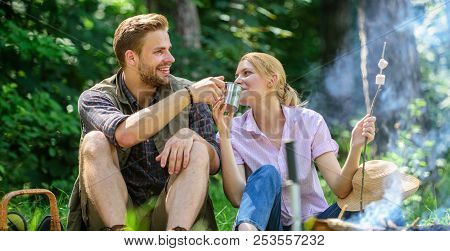 Weekend Picnic. Food For Hike And Camping. Couple Sit Near Bonfire Eat Snacks And Drink. Couple Take