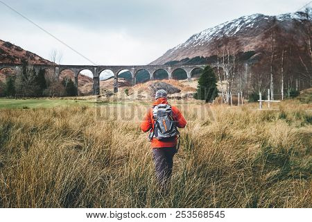 Hiking, Walk With Backpack, Active Lifestyle Concept Image. Man Traveler Walks Neaar Famous Glenfinn