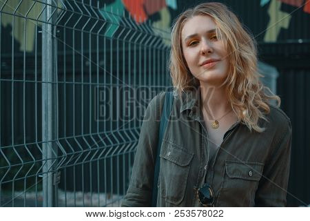 Urban People Concept. Carefree Young Woman Portrait Smiling, Drssed In Chaki Romper. City Lifestyle 