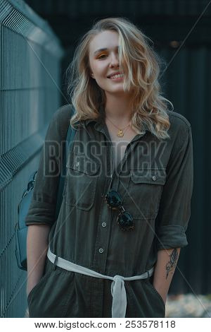 Urban People Concept. Carefree Young Woman Portrait Smiling, Drssed In Chaki Romper. City Lifestyle 