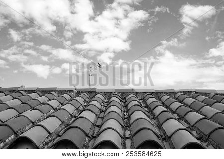 Roof With Terracotta Tile In Miami, Usa. Tile Roofing On Cloudy Blue Sky. Architecture And Design. R