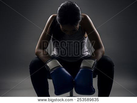 Black Female Wearing Boxing Gloves Looking Angry As A Boxer, Mma Fighter Or Self Defense Trainer Sit