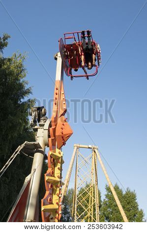 The Guy Sits On The Carousels In Gagarin Park, July 1, 2018, Russia, The City Of Sterlitamak