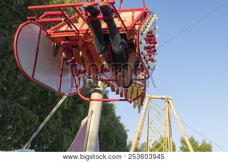 The Guy Sits On The Carousels In Gagarin Park, July 1, 2018, Russia, The City Of Sterlitamak