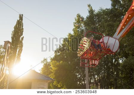 The Guy Sits On The Carousels In Gagarin Park, July 1, 2018, Russia, The City Of Sterlitamak
