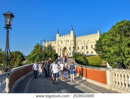 Lublin, Poland - August 11, 2017: The Royal Castle Of Lublin, Bridge With Tourists And Bright Blue S