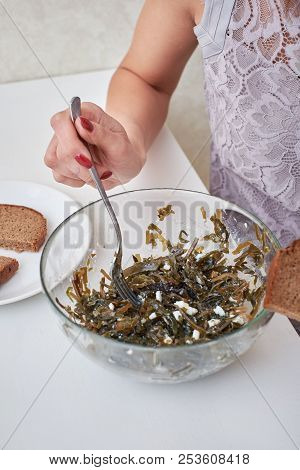 Beautiful Young Woman Eating Seaweed Salad. Dieting Concept. Healthy Food