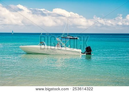 Man, Yachtsman On Motorboat On Water, In St. John, Antigua