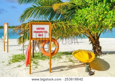 Emergency Equipment On A Beach With A Palm Tree In Maledives