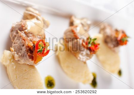 Pork Medallions With Mashed Potato And Mushrooms. Pork Tenderloin On A White Plate, Good Serving. Re