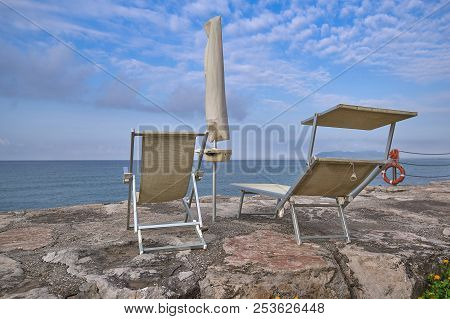 Beach At The End Of The Season, Lack Of People And Folded Umbrel