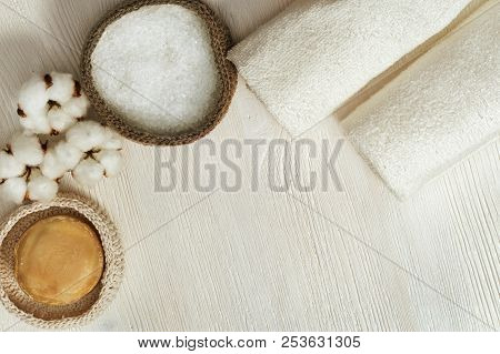 Spa Background. Fluffy Flower Of Cotton Plant, Sea Salt, Clear Rolled Towels, Round Soap On White Wo