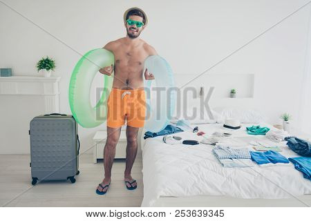Full Length Size Body Portrait Of Attractive Handsome Young Bearded Smiling Man In Bedroom, Carrying