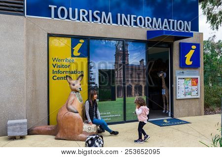 Melbourne, Australia - February 28, 2018: Mother And Child In Front Of The Tourism Information Offic