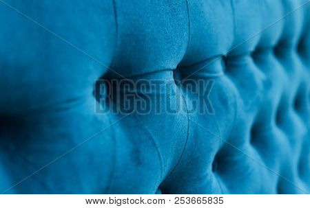 Velour Surface Of Sofa Close-up. Coach-type Velours Screed Tightened With Buttons. Blue Chesterfield