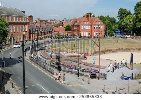 Chester, Uk: Aug 6, 2018: A Travelodge Hotel Is Directly Opposite The Remains Of A Roman Amphitheatr