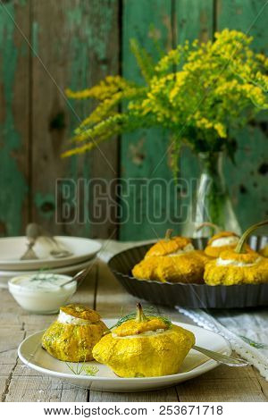 Pattypan Squash Or Pumpkins Stuffed With Ricotta With Basil And Dill And Served With Sour Cream Sauc