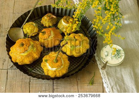Pattypan Squash Or Pumpkins Stuffed With Ricotta With Basil And Dill And Served With Sour Cream Sauc