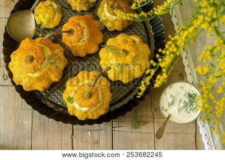Pattypan Squash Or Pumpkins Stuffed With Ricotta With Basil And Dill And Served With Sour Cream Sauc