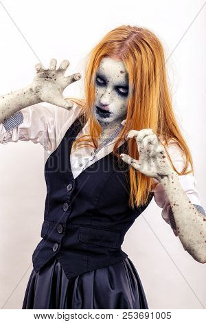 Zombie Girl Attack With Yellow Hair In Attack Pose On White Background