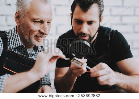 Two Men Repairing Hardware Equipment From Pc. Repair Shop. Worker With Tools. Computer Hardware. You