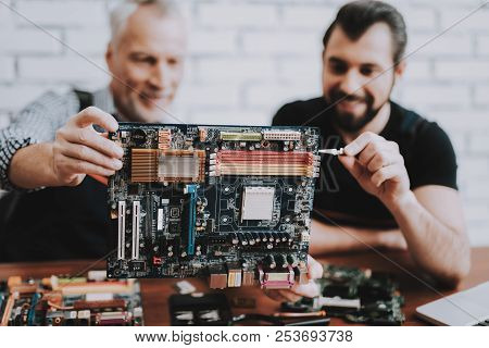 Two Men Repairing Hardware Equipment From Pc. Repair Shop. Worker With Tools. Computer Hardware. You