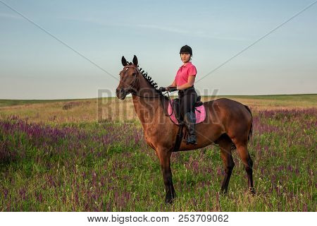 Horsewoman Jockey In Uniform Riding Horse Outdoors