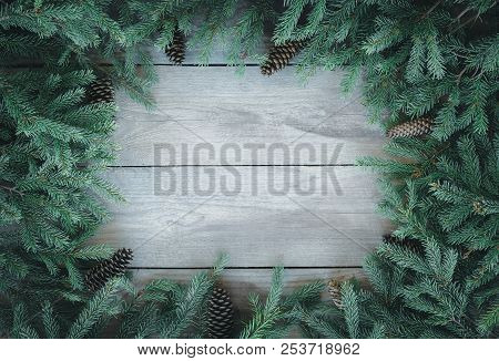 Christmas Firbranch With Cones On Old Wooden Rustic Background With Copy Space For Text, Toned