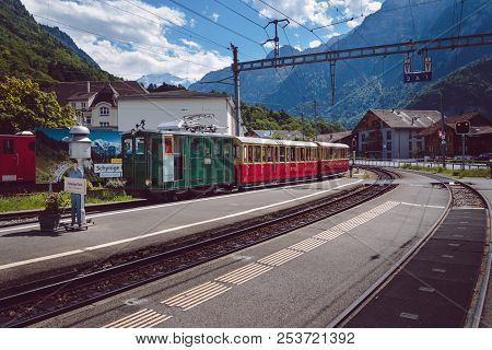 Wilderswil, Bernese Oberland, Switzerland - August 5, 2017 : Retro Passenger Train Arrives In The Wi