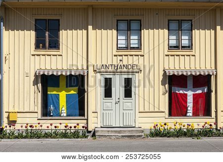 Kristianopel, Sweden On May 14. View Of A Front, Old Local Store, Danish And Swedish Flag On May 14,