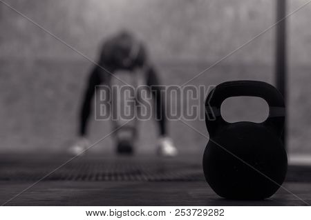 Athletic Young Man Working Out In Gym. Muscular Male Adult Exercising With Kettle Bells, Functional 