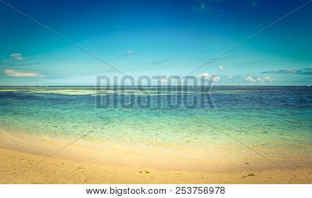 Sandy tropical Wolmar beach at sunny day. Beautiful landscape. Panorama. Mauritius