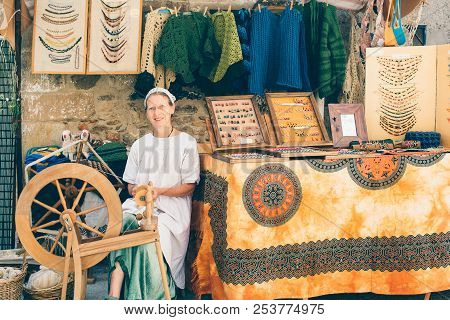 Puertomingalvo, Teruel, Spain - August 5, 2018: Portrait Of A Smiling Spinner Woman In Traditional C