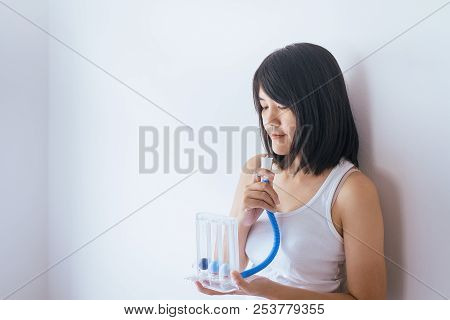 Patient Woman Using Incentivespirometer Or Three Balls For Stimulate Lung On White Blackground