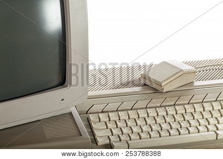 Outdated Technology. Dirty Vintage Computer System With Keyboard And Monitor. Retro Eighties Computi