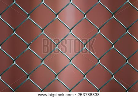 Close-up Of Isolated Painted Simple Geometric Black Iron Metal Wire Chain Link Fence Eon Dark Red Ba