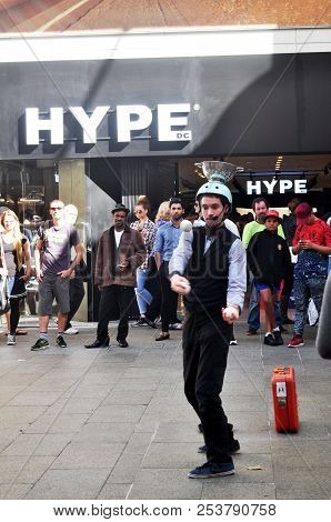 Australian People Show Throwing Ball At Patio Outdoor Activitie Of Myer City Store In Perth, Austral