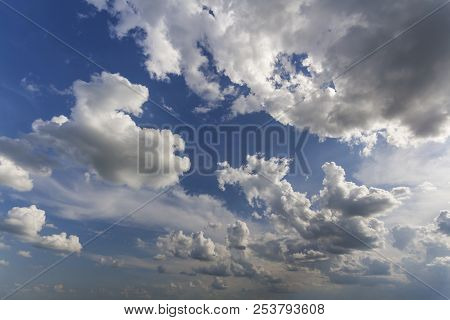 Fantastic Panorama View Of Bright White Puffy Clouds Lit By Sun Spreading Against Deep Blue Summer S