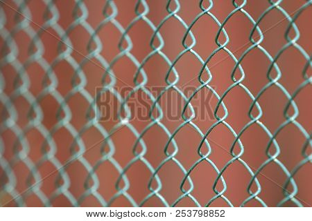 Close-up Of Isolated Painted Simple Geometric Black Iron Metal Wire Chain Link Fence Eon Dark Red Ba