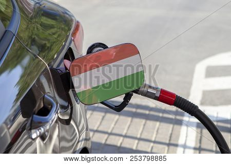 Fueling Car With Petrol Pump At A Gas Station.