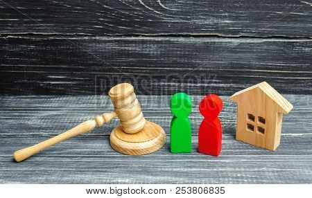 Clarification Of Ownership Of The House. Court. Wooden Figures Of People. Rivals In Business. Compet
