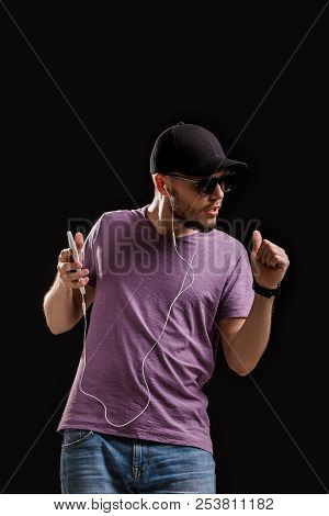 The Man Listening To Music In Headphones