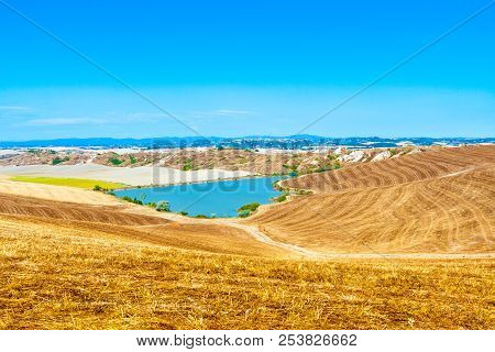 Lake In Crete Senesi (senese Clays) In Summer Near Siena In Tuscany, Italy