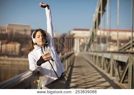 Young Athlete Woman With Mobile Phone Outdoor
