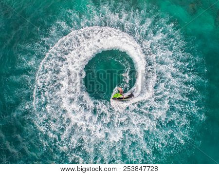 People Are Playing Jet Ski At Sea During The Holidays. Aerial View And Top View.